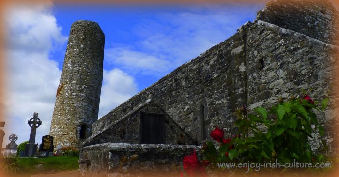 Round tower and medieval church at Aghagower, County Mayo, Ireland.