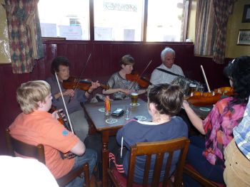 Irish Folk Music session at Minogues Pub in Tulla, County Clare, Ireland.