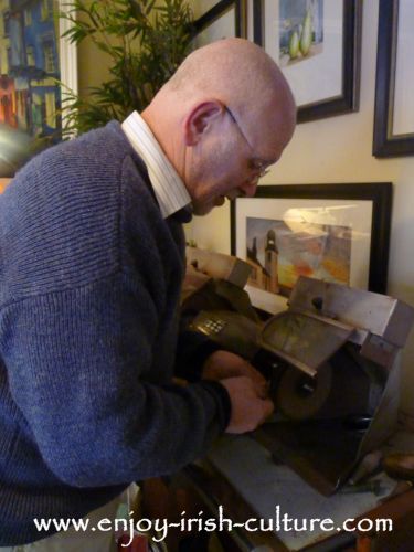 A Claddagh ring being polished at the original Claddagh ring shop, Galway, Ireland, by Johnathan Margetts, proprietor.