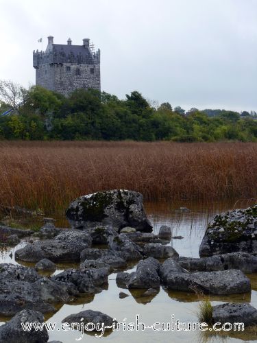 Annaghdown Castle, County Galway, Ireland, summer, seen from the lakeshore.