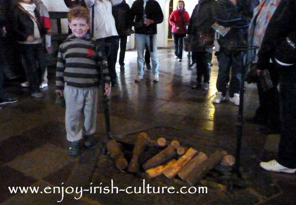 The central fireplace in the Great Hall at Bunratty Castle, County Clare, Ireland.