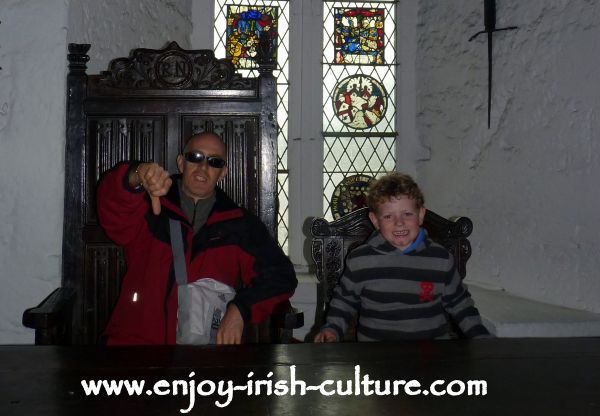 The Earl's chair in the great hall at Bunratty Castle, County Clare, Ireland.