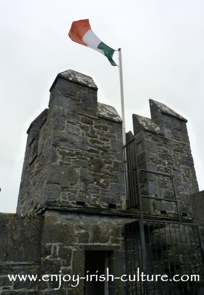 Irish flag on the turretts of Bunratty Castle, County Clare, Ireland