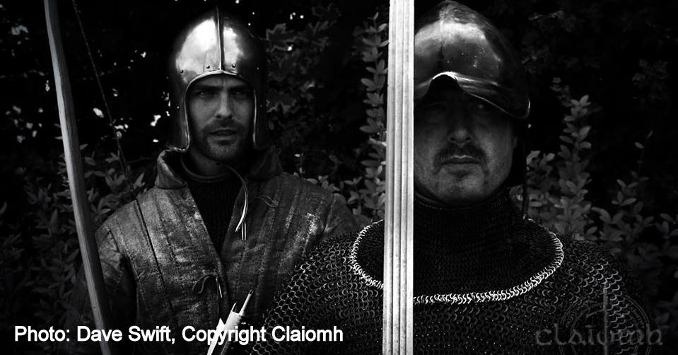 Galloglaigh warriors of medieval Ireland carrying a bow and sword.