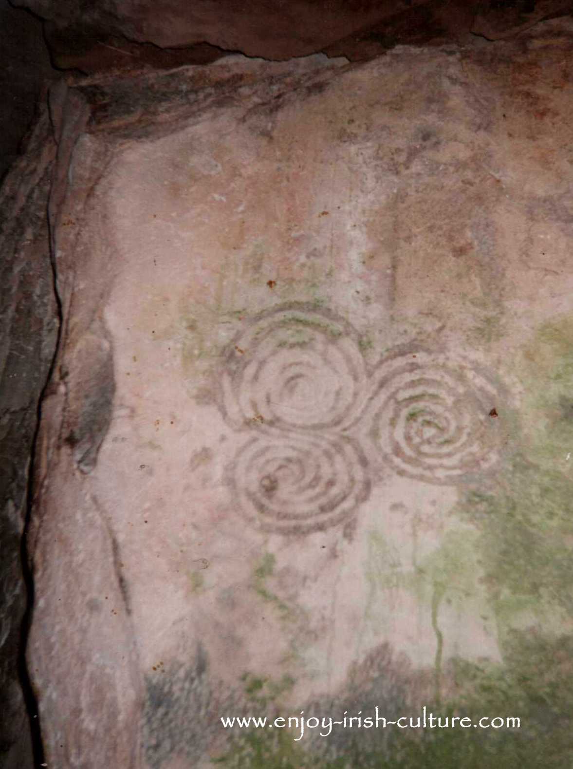 Triskel art inside the Newgrange passage tomb, Counth Meath, Ireland.