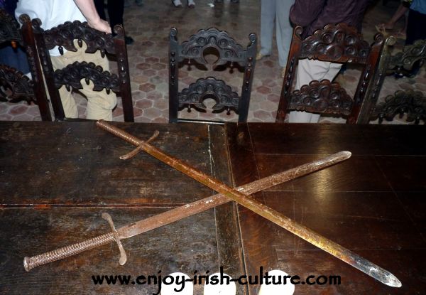 Swords on the table of the great hall at Claregalway Castle, County Galway, Ireland.