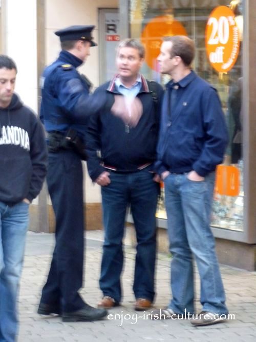Gardai chatting to people in the street.