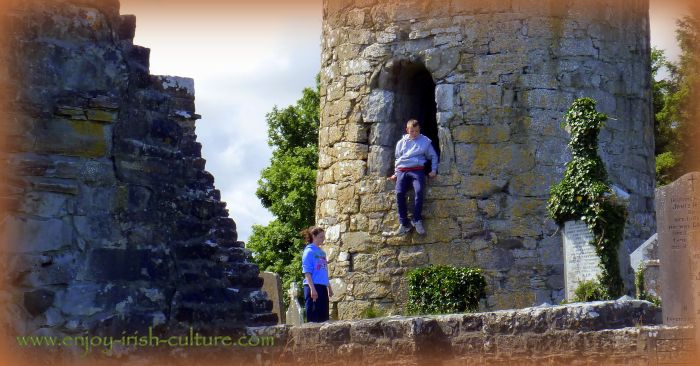 Local kids playing in the round tower of the monastic site at Aghagower, County Mayo, Ireland.