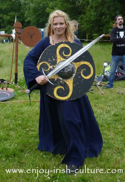 Medieval Ireland-female Irish warrior with sword and wooden shield, reenacted by Eireann Edge.