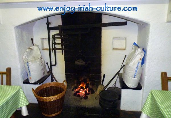 The hearth of the Irish cottage, now the coffee shop at the outdoor heritage museum of Craggaunowen at Quin, County Clare, Ireland.